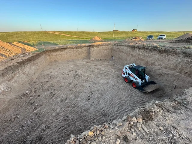 Excavation site prep with skid steer in Laramie County Wyoming